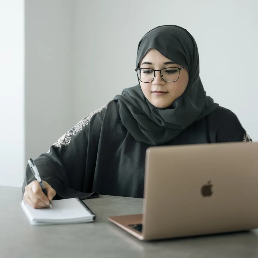 A portrait of Bouchra Rebiai, host of the Arabic translation podcast TART Bites, and Founder and Chief Creative Officer at Aurora Hikma in Dubai.